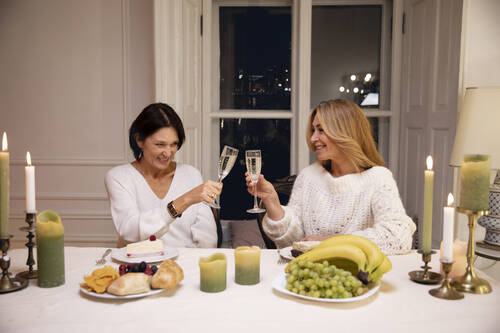 Middle age friends night having dinner